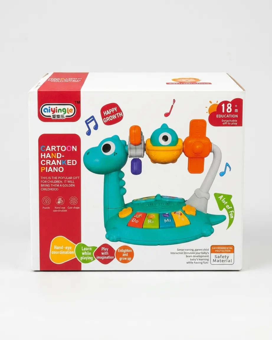 Kids dinosaur hand-crank piano toy shown on retail box packaging