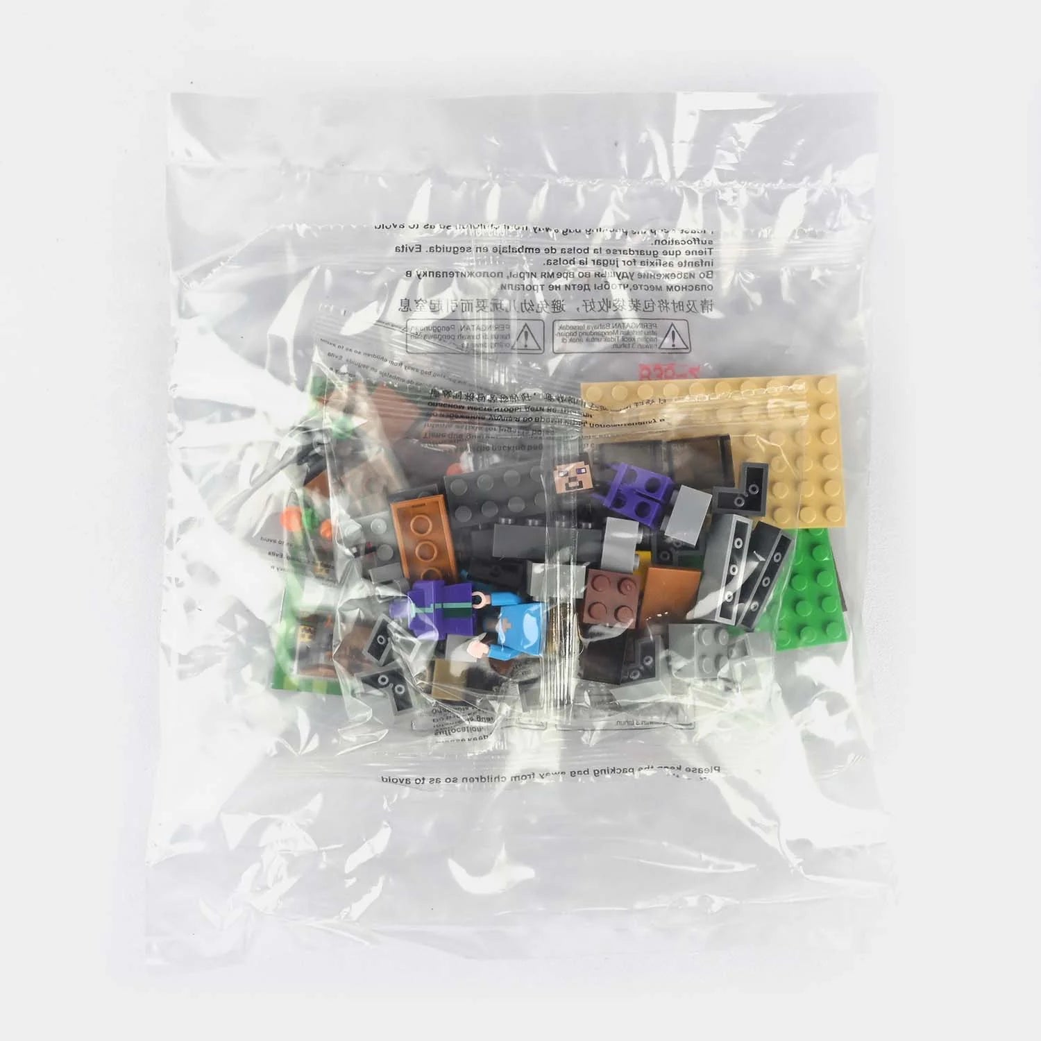 Building brick set pieces in clear plastic bag, mixed colored blocks and parts