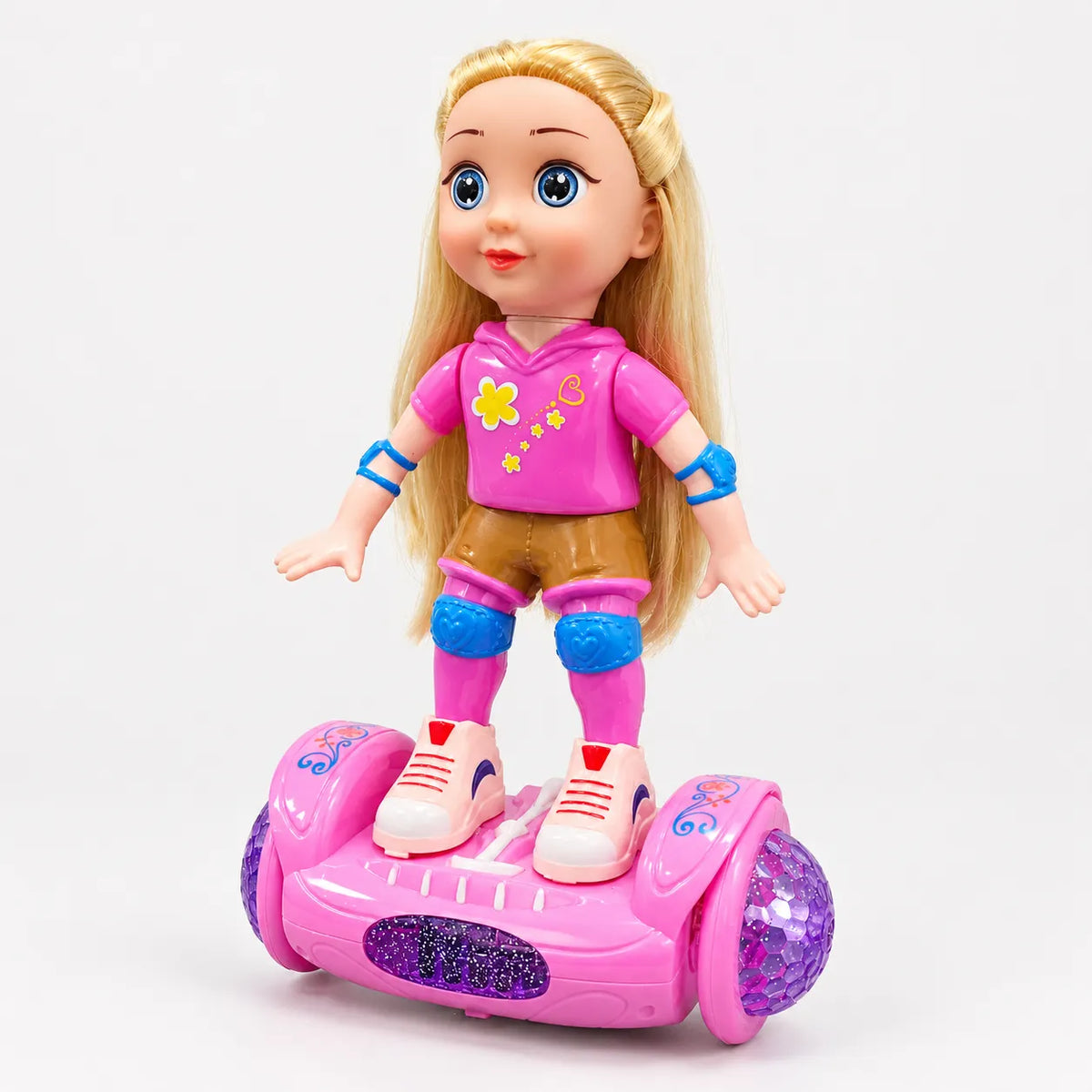 Blonde doll in a pink sporty outfit with blue pads standing on a pink hoverboard-style toy base