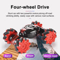 Red and black four-wheel drive stunt RC car with oversized off-road tires