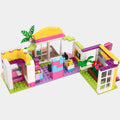 Multi-level shopping mall building blocks with yellow, pink, and green details