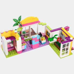 Multi-level shopping mall building blocks with yellow, pink, and green details