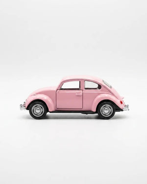 Volkswagen Beetle diecast model car toy, light pink side view with wheels and chrome