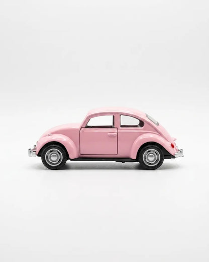 Volkswagen Beetle diecast model car toy, light pink side view with wheels and chrome