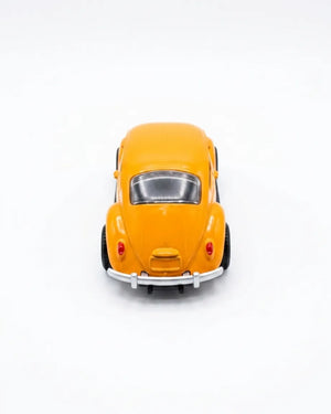 Volkswagen Beetle diecast model car toy, yellow-orange, front view with chrome bumper