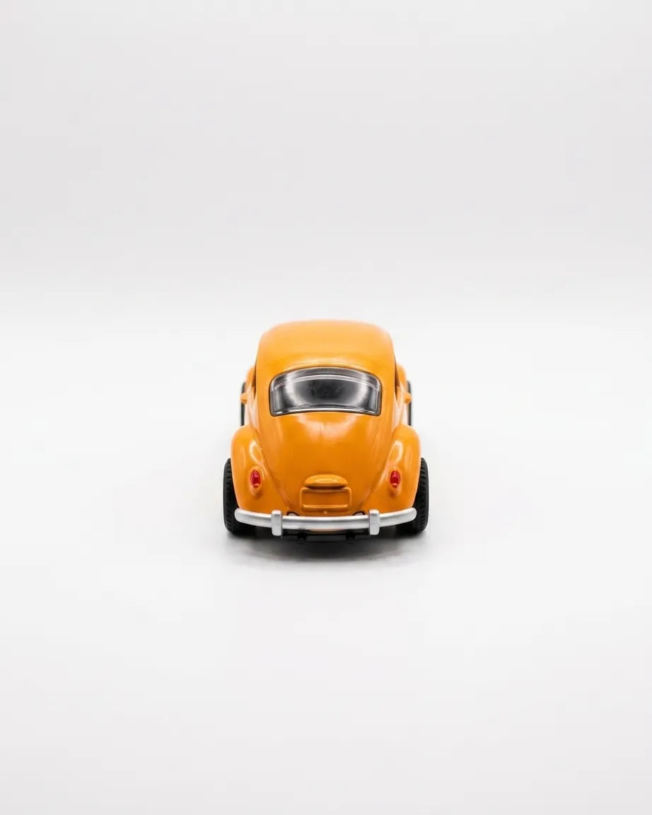 Volkswagen Beetle diecast model car toy, yellow-orange, close front view with grille