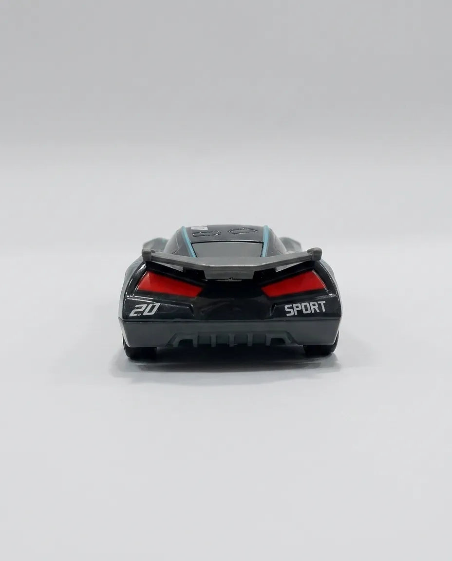 Rear view of black diecast race car with red tail lights and SPORT lettering