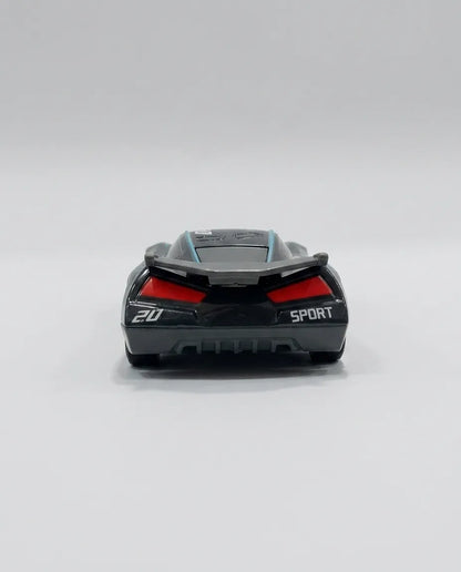 Rear view of black diecast race car with red tail lights and SPORT lettering