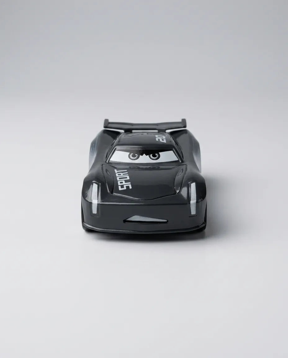 Top rear view of black diecast race car with spoiler and SPORT text on bumper
