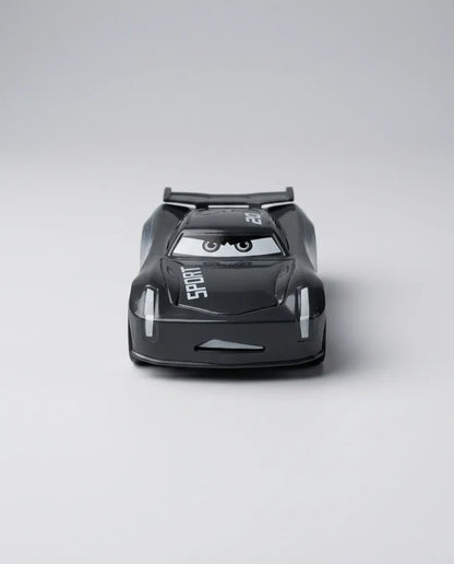 Top rear view of black diecast race car with spoiler and SPORT text on bumper