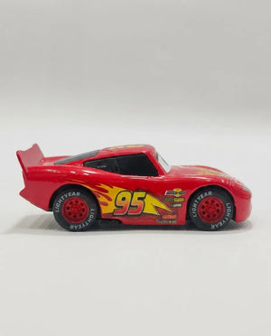 Red diecast pull-back car, three-quarter side view, #95 racing decals