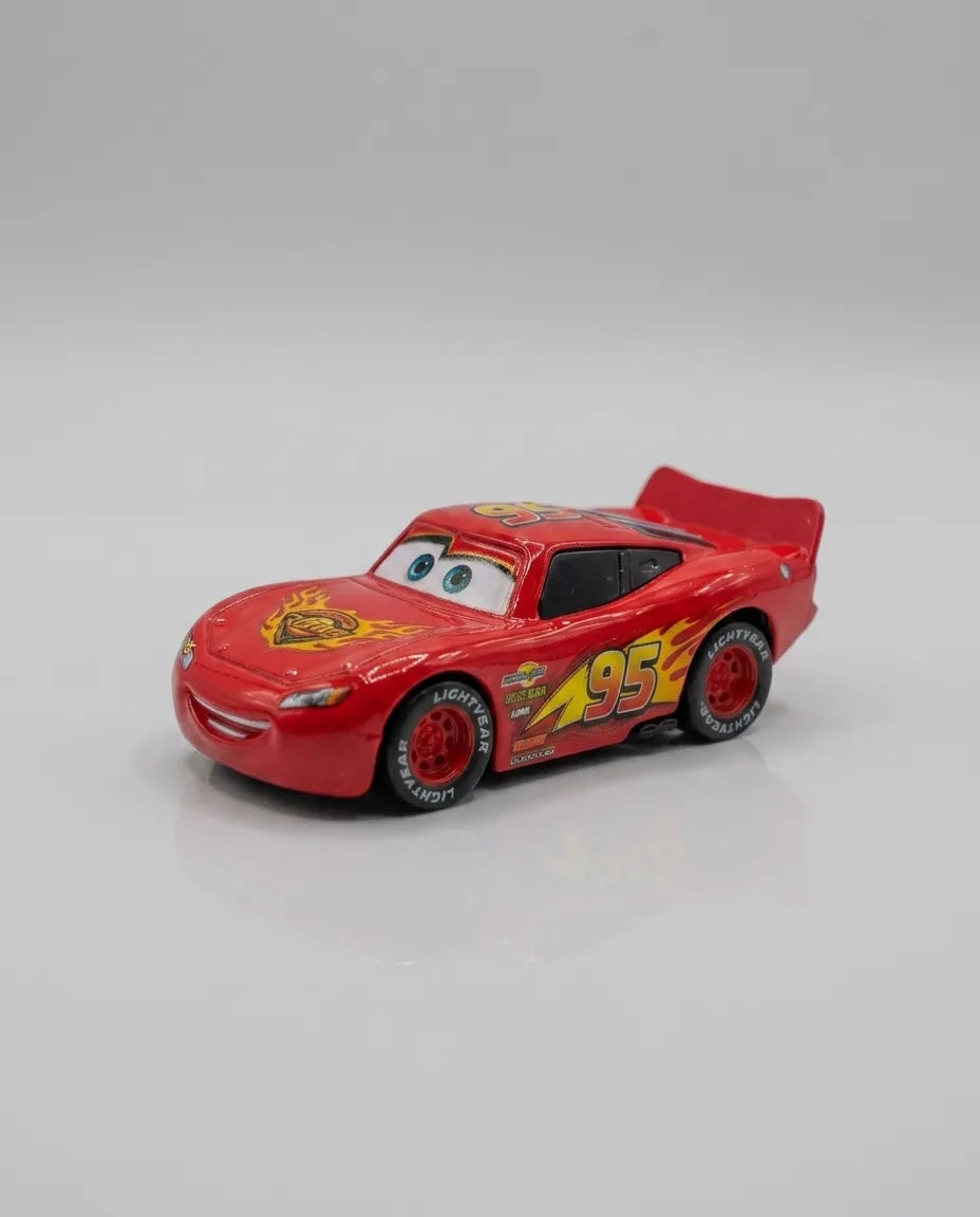 Red diecast pull-back car with friendly face and #95 front hood graphic