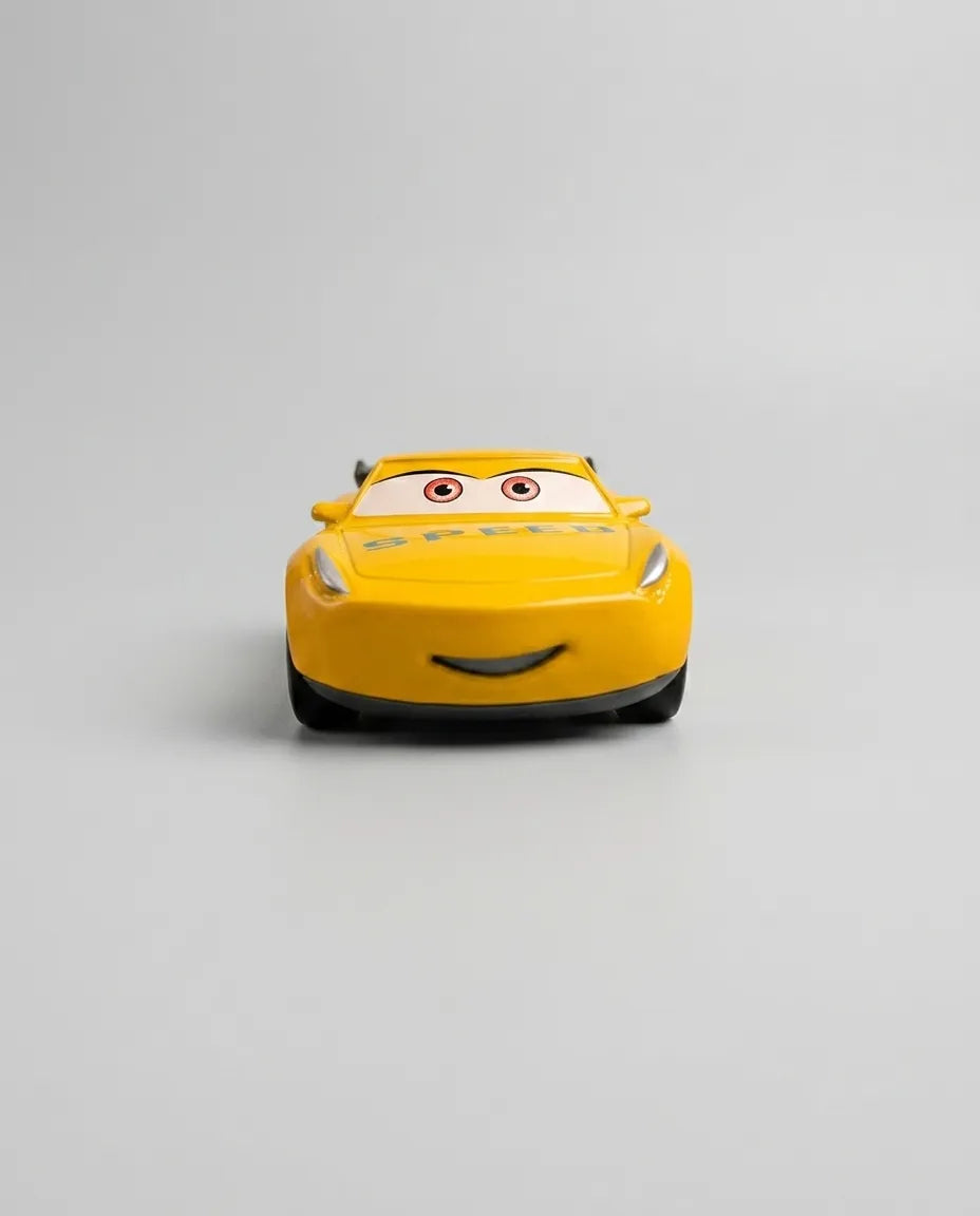 Disney Pixar Dinoco diecast pull-back car, yellow front with smile and Speed emblem