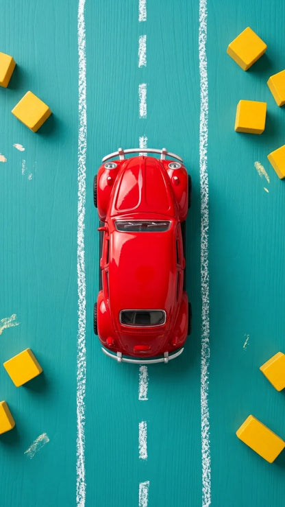 Red Volkswagen Beetle diecast model car toy, top view with chrome details