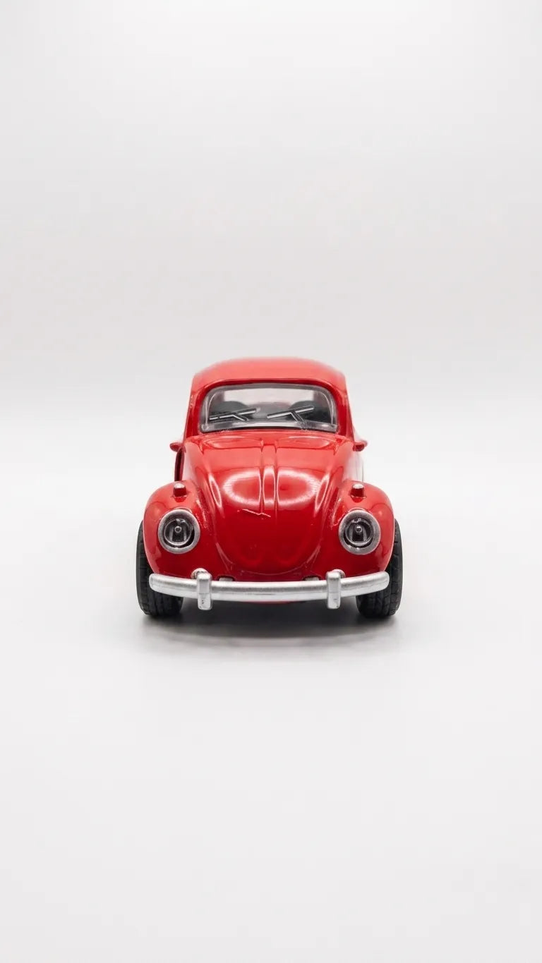 Red Volkswagen Beetle diecast model car toy, front view with chrome grille