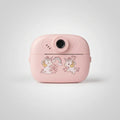 Pink kids instant print camera with unicorn and rainbow decoration on the front