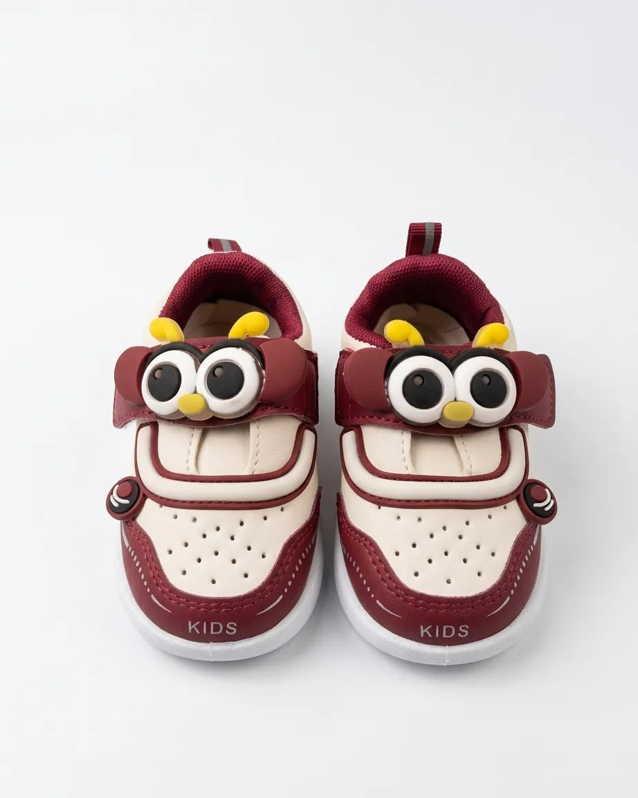 Maroon and cream owl cartoon kids shoes with large eyes and yellow accents, front view