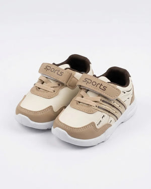 Beige kids sports sneakers shown as a pair with laces and hook-and-loop straps