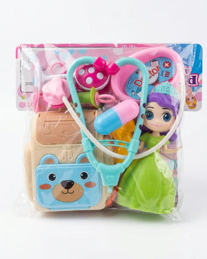 Doctor toy set in clear packaging: pink stethoscope, light-blue tools, and green gown figure