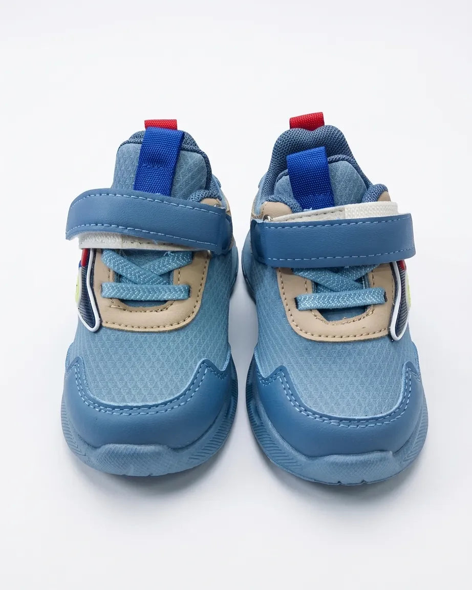 Beige kids cartoon chunky sneaker with blue accents and strap, side view