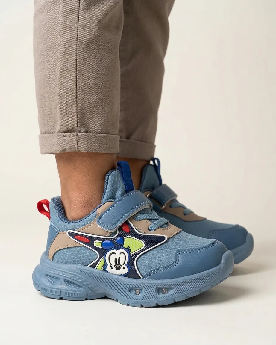 Blue kids cartoon chunky sneaker with colourful side patch, side view