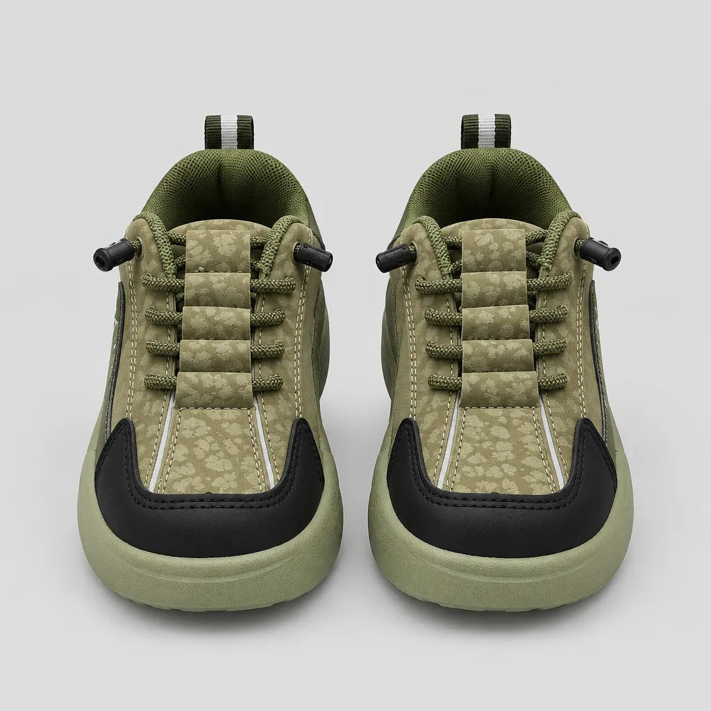 Pair of green Trail kids sneakers showing lace detailing and contrast toe panels