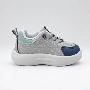 Grey-toned Trail kids sneaker listed as Beige, with navy and pale green accents, outer side