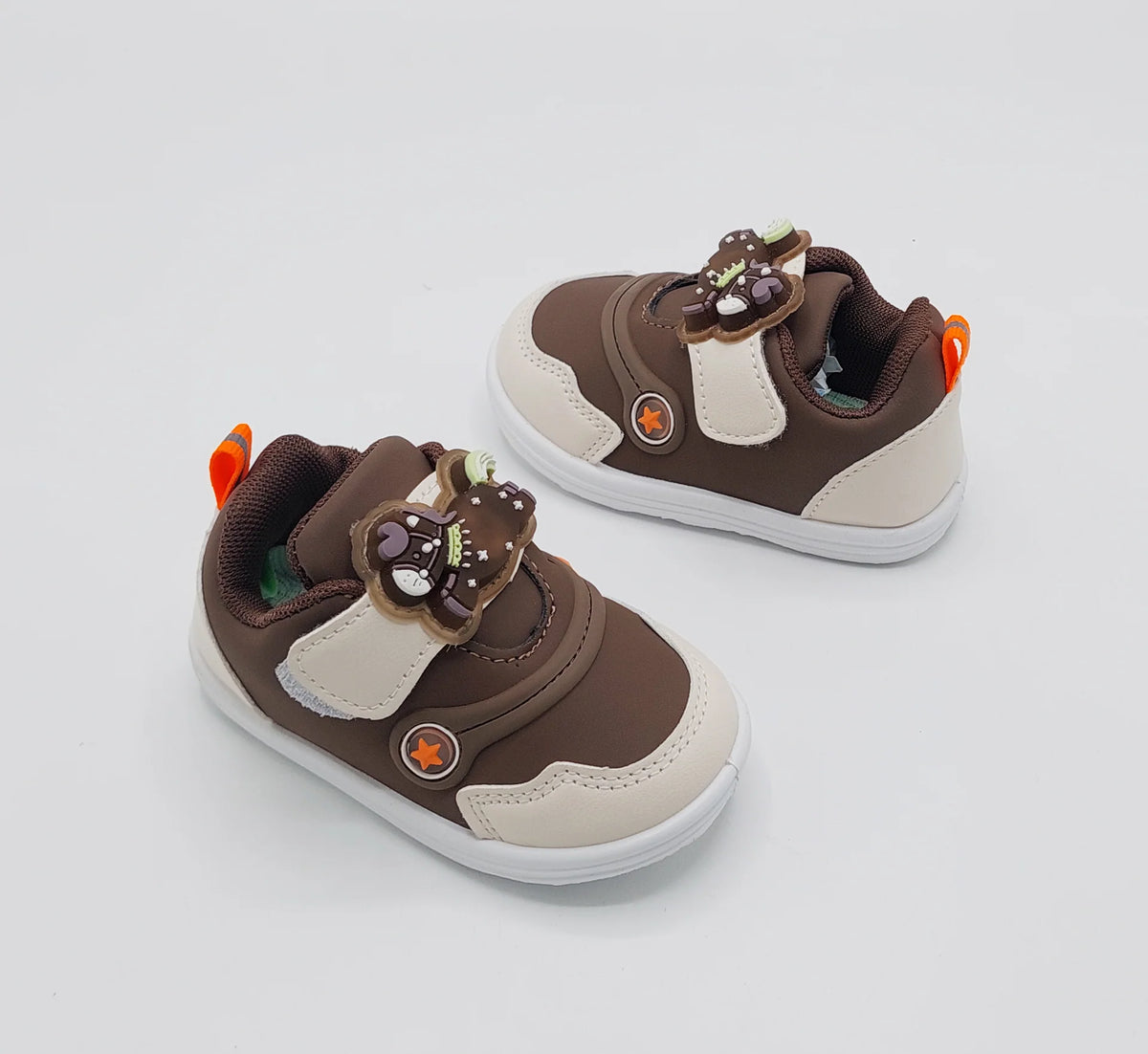 Brown kids' sneakers with bear appliques, white sole and bright orange lace tabs