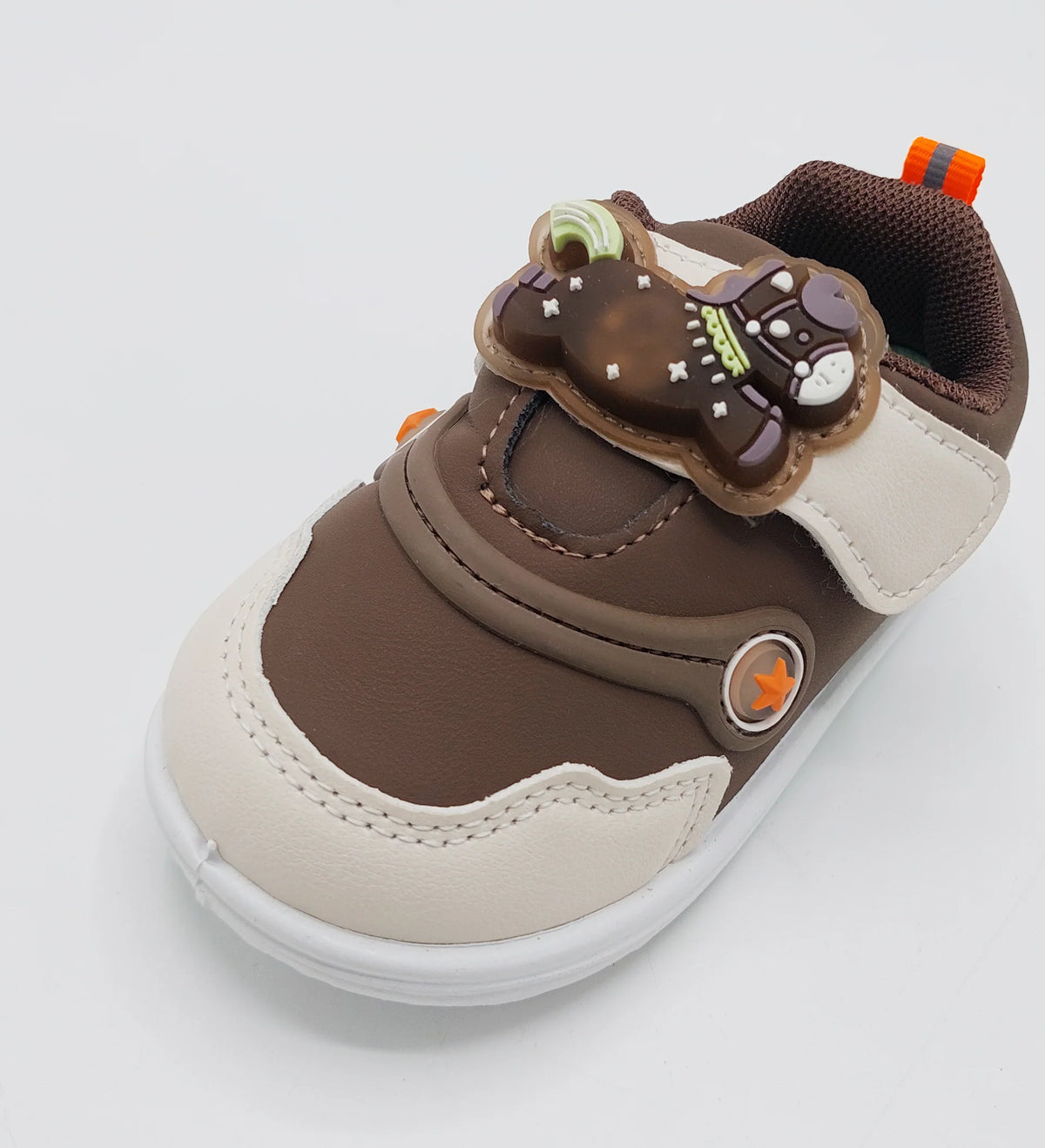 Pair of brown Glow Bear kids shoes showing illuminated lights on bear-detail straps