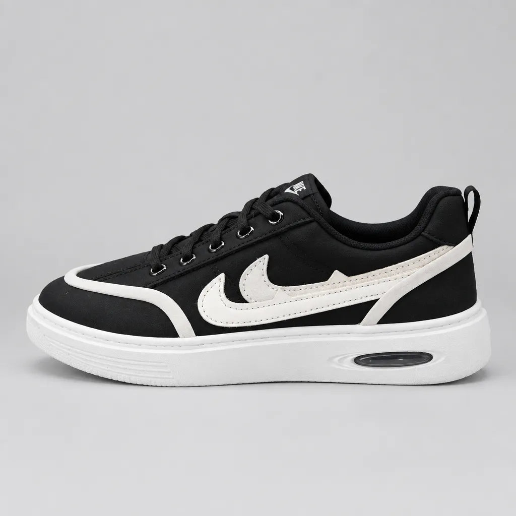 Front view of Black DuoTrim kids sneakers showing black laces and white toe trim