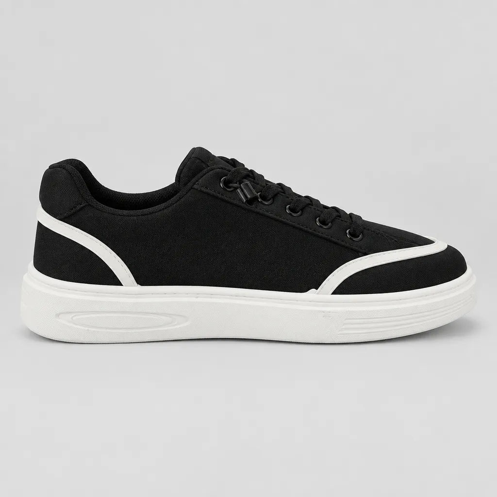 Inner side of Black DuoTrim kids sneaker showing white trim and low-top profile