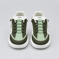 Front view of Pale Green DuoTrim kids sneakers showing green laces and contrast toe panels