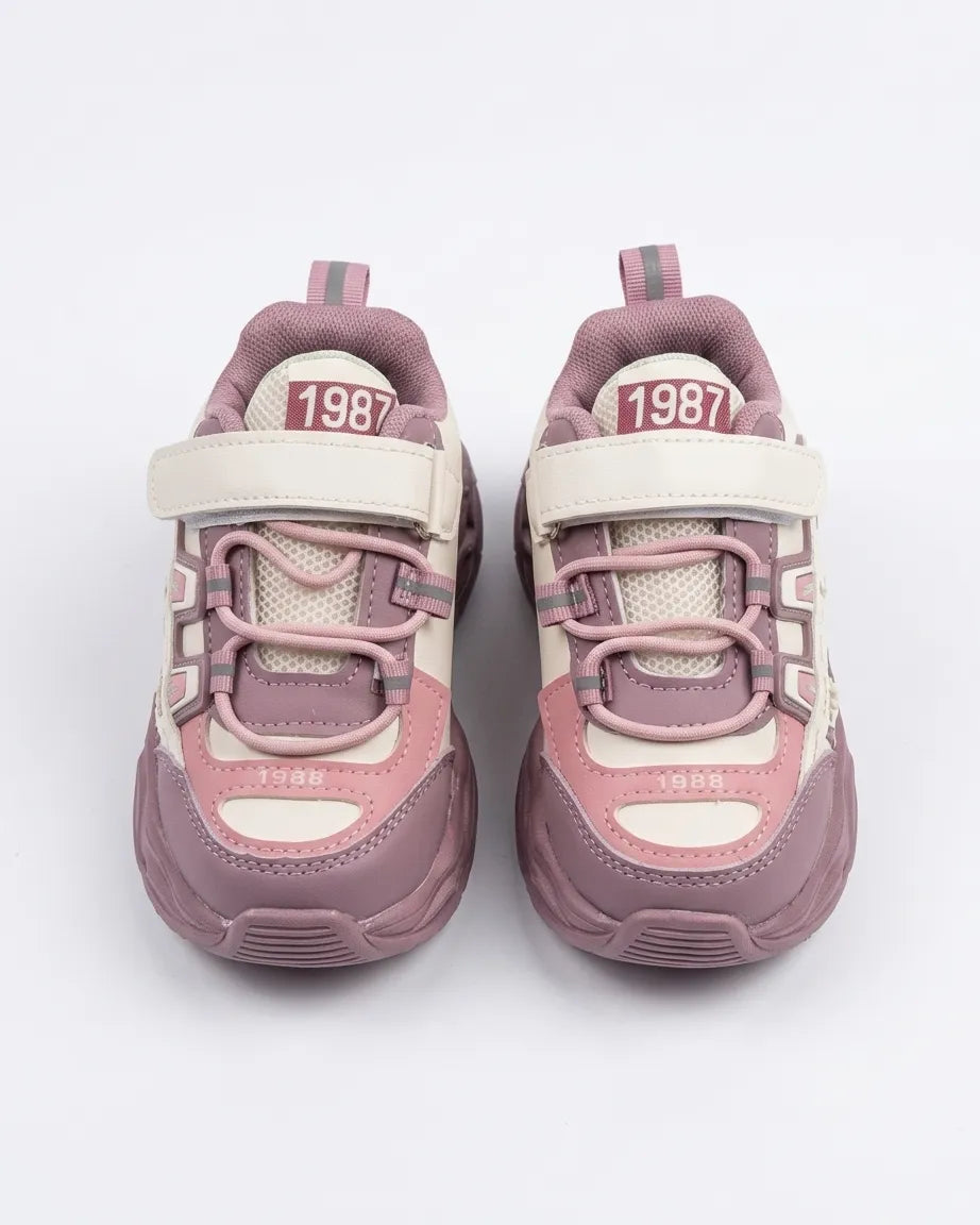 Blue and cream kids chunky sneakers worn by a child, front angle