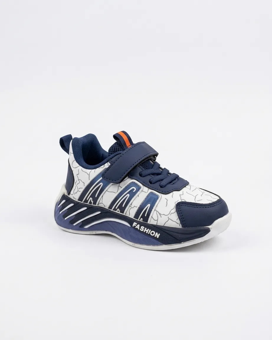 Three-quarter view of navy and white kids strap sneaker showing navy laces, patterned upper and toe cap