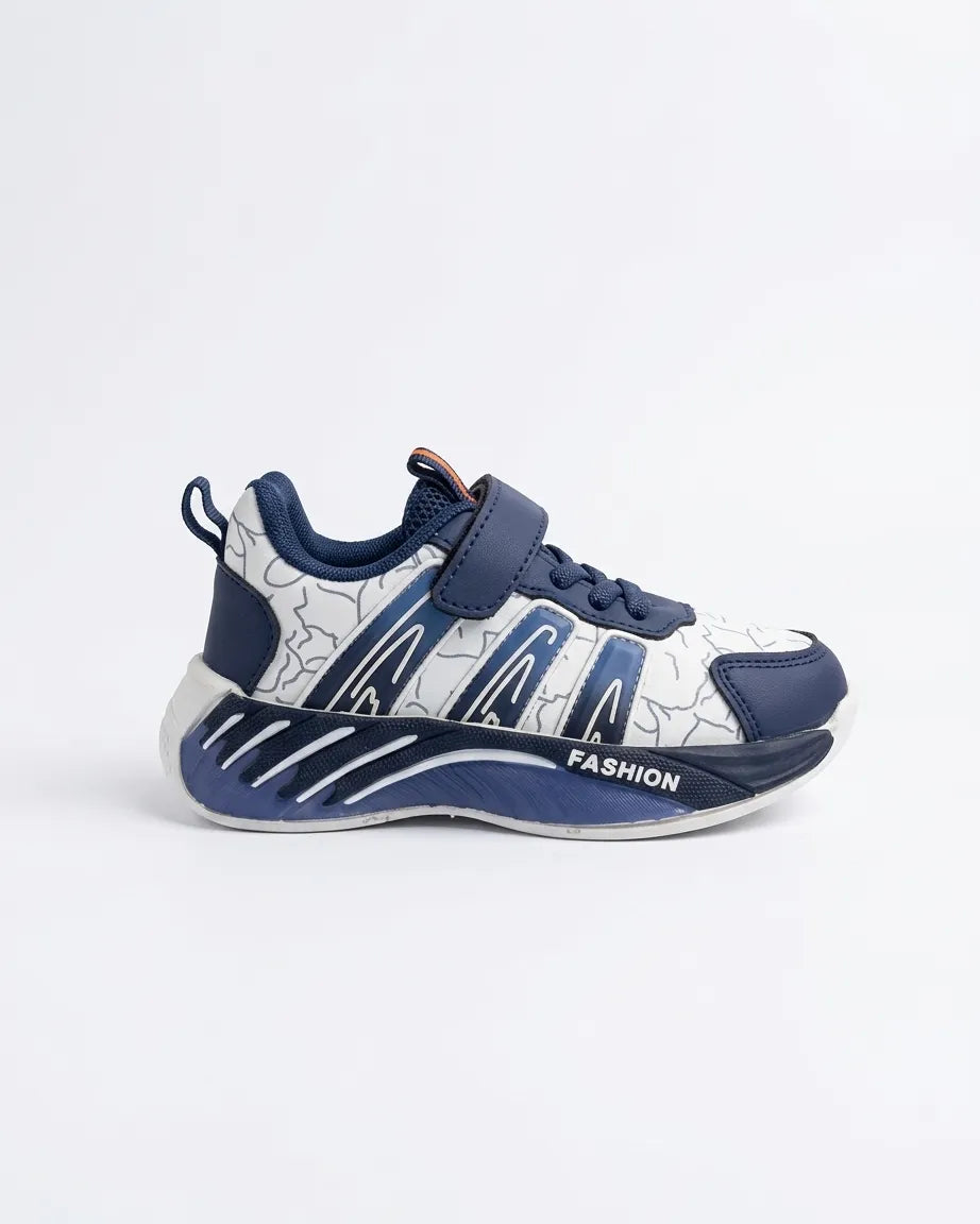 Side profile of navy and white kids strap sneaker with patterned upper and chunky navy sole