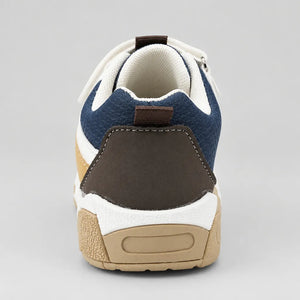 Outer side of navy white and brown kids sport sneaker with hook-and-loop strap