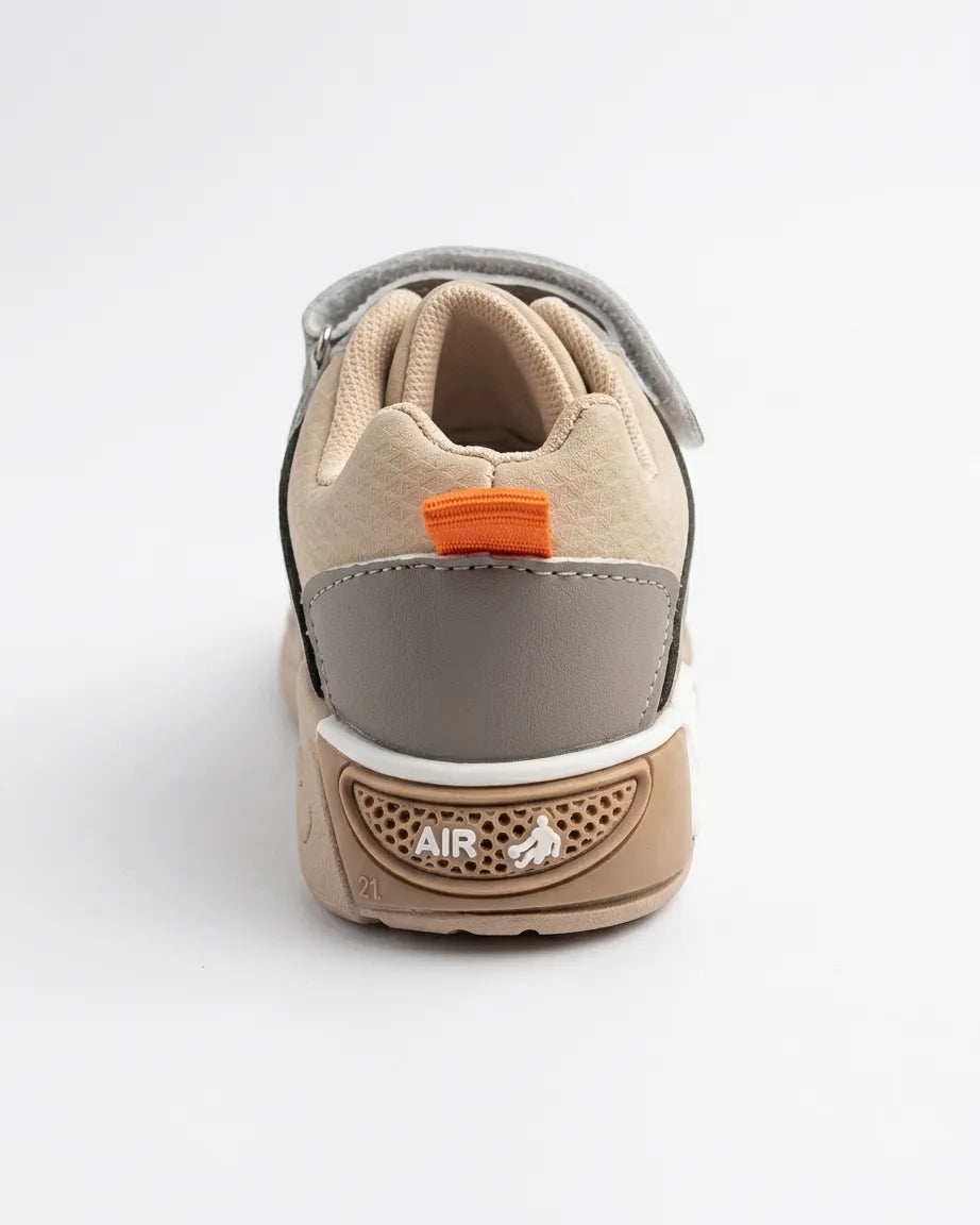Angled view of beige and olive kids sneakers with hook-and-loop strap