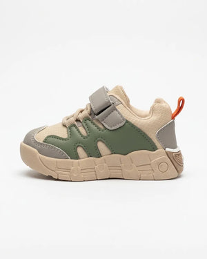 Pair of beige and olive kids sneakers shown from the front
