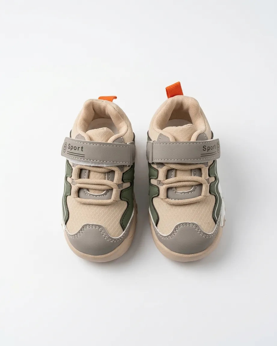 Heel view of beige and olive kids sneaker with pull tab