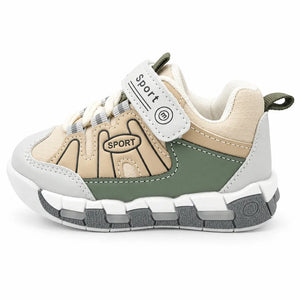 Front view of beige and olive green kids sneakers with grey accents, lace-style detailing and hook-and-loop straps