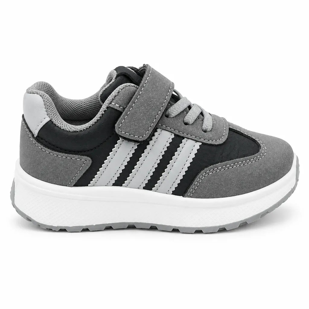 Front view of grey and black kids’ sneakers with hook-and-loop straps and lace-style fronts