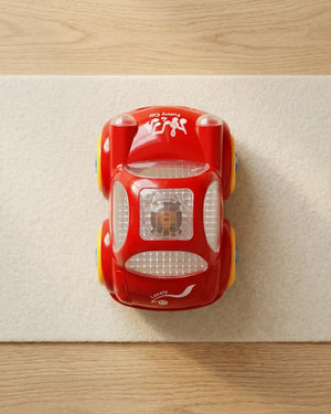 Top view of red toy car with clear roof and yellow and blue side details