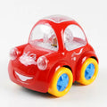 Red toy bump car with clear windshield, blue wheels, and smiling face front view
