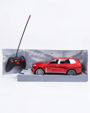 A red remote-controlled toy SUV displayed in its gray retail box, alongside a black handheld controller with a long antenna, on a clean white background.