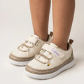 Kids cartoon dinosaur sneakers in pink with double elastic lace-style detail and hook-and-loop strap