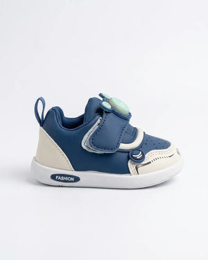 Side view of blue kids sneakers with hook-and-loop strap