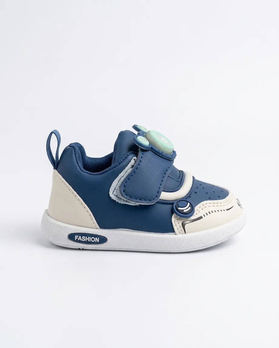 Side view of blue kids sneakers with hook-and-loop strap