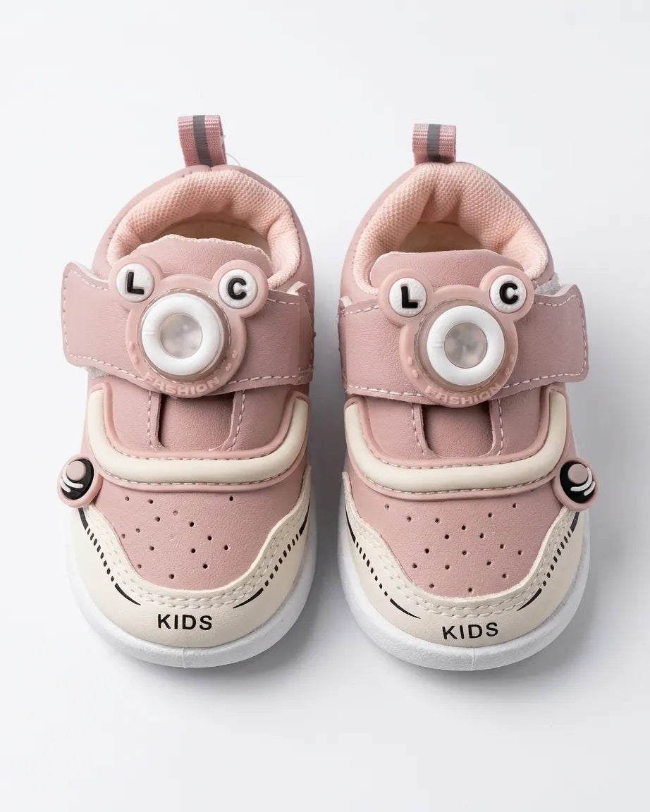 Angled view of blue cartoon kids sneakers with padded collar