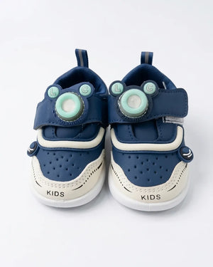 Front view of pink cartoon strap kids sneakers in a pair