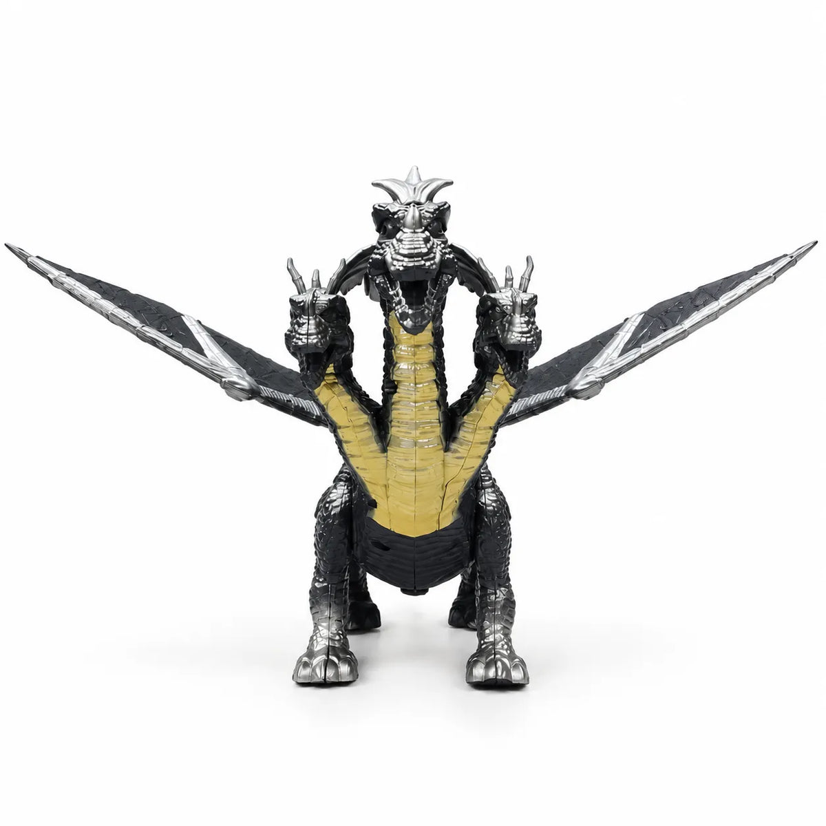 Front view of a silver and black three-headed dragon toy with spread wings and yellow chest